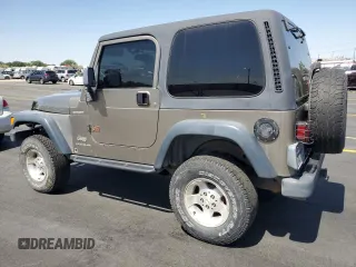 2003 Jeep Wrangler Sport z VIN 1J4FA49S43P327283, wystawiony jako Copart lot #59036295 z przebiegiem 158 108 mil mil oraz Szkoda całkowita • Salvage title. Historia ofert i sprzedaży dostępna na DreamBid. Obrazek 2.