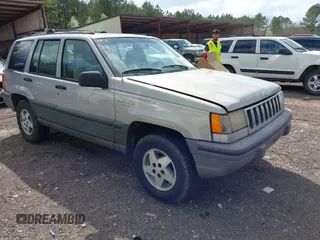 1994 Jeep Grand Cherokee Laredo with VIN 1J4GZ58Y0RC200247, listed as a IAAI auction lot 41781078 with 217,698 mi miles. Bid and sale history available at carsss.com. Image 1.