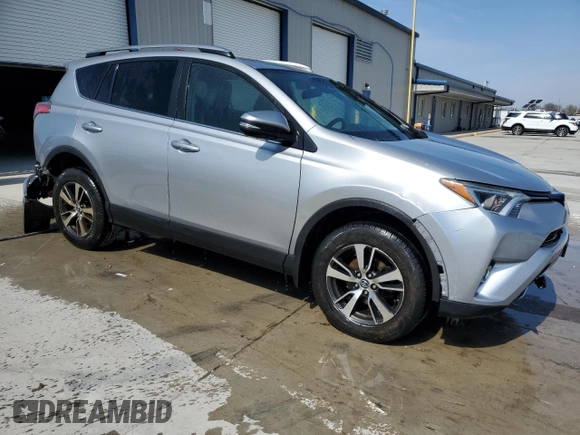 2018 Toyota RAV4 XLE with VIN 2T3RFREV3JW740122, listed as a Copart auction lot 51339045 with 115,293 mi miles and Salvage Title. Bid and sale history available at DreamBid. Image 4.