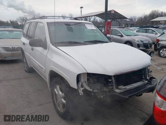 2005 GMC Envoy SLT with VIN 1GKDT13S952190876, listed as a IAAI auction lot 41308686 with 244,774 mi miles. Bid and sale history available at carsss.com. Image 13.