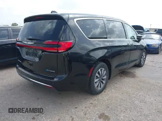 2023 Chrysler Pacifica Hybrid Touring L with VIN 2C4RC1L75PR611901, listed as a IAAI auction lot 42626500 with 44,156 mi miles and . Bid and sale history available at DreamBid. Image 4.