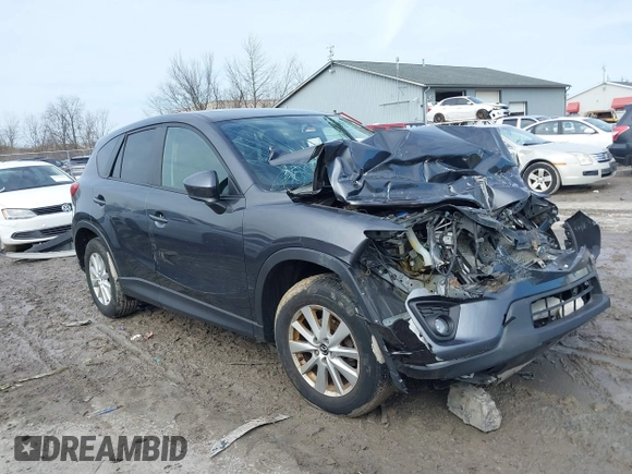 2014 Mazda CX-5 Touring with VIN JM3KE4CY6E0387767, listed as a IAAI auction lot 41698128 with 1 mi miles. Bid and sale history available at carsss.com. Image 1.