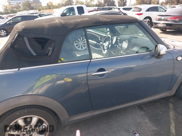 2010 MINI Convertible with VIN WMWMR3C53ATU97865, listed as a IAAI auction lot 41610670 with 154,457 mi miles and . Bid and sale history available at DreamBid. Image 6.