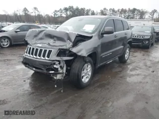 2016 Jeep Grand Cherokee Laredo with VIN 1C4RJFAG0GC325114, listed as a IAAI auction lot 40878955 with 277,225 mi miles. Bid and sale history available at carsss.com. Image 2.