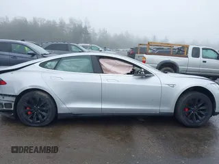 2014 Tesla Model S 60 with VIN 5YJSA1H18EFP30143, listed as a IAAI auction lot 42190505 with Not provided miles and . Bid and sale history available at DreamBid. Image 12.