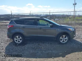 2016 Ford Escape SE with VIN 1FMCU9GX5GUA06660, listed as a IAAI auction lot 42043031 with 87,719 mi miles. Bid and sale history available at carsss.com. Image 13.