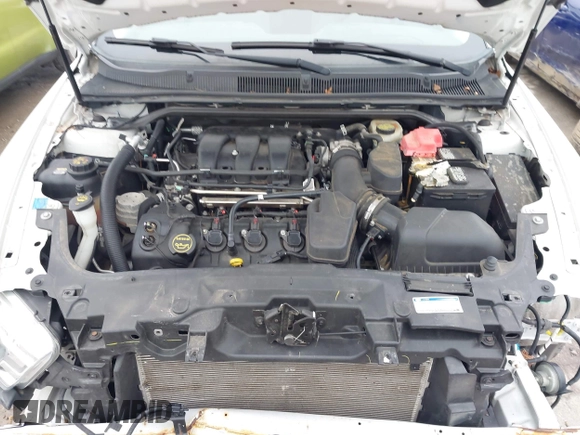 2015 Ford Taurus Limited with VIN 1FAHP2F85FG117635, listed as a IAAI auction lot 41979311 with 104,314 mi miles. Bid and sale history available at carsss.com. Image 10.