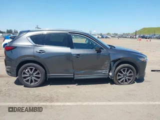 2017 Mazda CX-5 Grand Touring with VIN JM3KFADL6H0217850, listed as a IAAI auction lot 42033404 with 74,198 mi miles and . Bid and sale history available at carsss.com. Image 14.