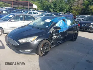 2016 Ford Focus Titanium with VIN 1FADP3J26GL335843, listed as a IAAI auction lot 42799795 with 167,506 mi miles and . Bid and sale history available at DreamBid. Image 2.