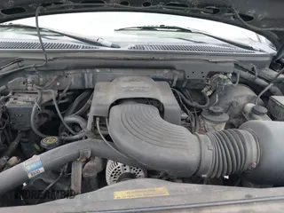 2000 Ford F-150 XL with VIN 1FTRX18W9YNA63551, listed as a IAAI auction lot 41446703 with Not provided miles and . Bid and sale history available at DreamBid. Image 10.