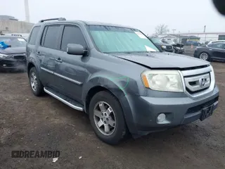 2010 Honda Pilot Touring with VIN 5FNYF4H80AB011277, listed as a IAAI auction lot 41829429 with 147,740 mi miles. Bid and sale history available at carsss.com. Image 1.