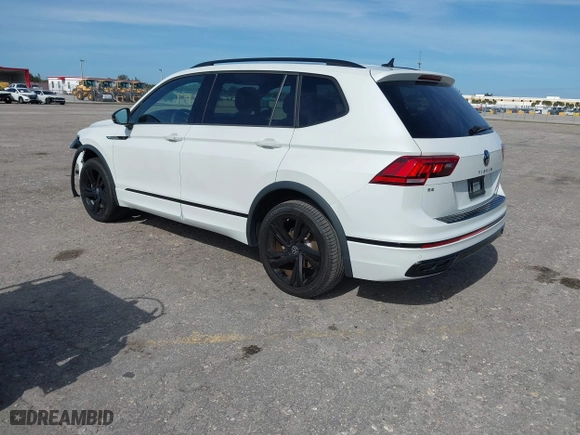 2023 Volkswagen Tiguan SE R-Line Black with VIN 3VVCB7AX0PM090710, listed as a IAAI auction lot 41256904 with 12,819 mi miles. Bid and sale history available at carsss.com. Image 3.
