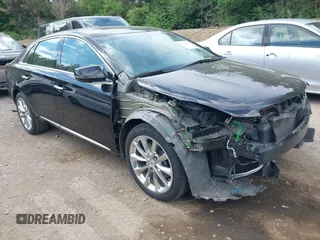 2013 Cadillac XTS Luxury z VIN 2G61R5S32D9246125, wystawiony jako IAAI lot #42261263 z przebiegiem 89 390 mil mil oraz . Historia ofert i sprzedaży dostępna na DreamBid. Obrazek 1.