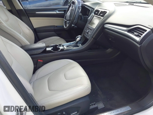 2016 Ford Fusion Titanium with VIN 3FA6P0K96GR400436, listed as a IAAI auction lot 42191256 with 128,447 mi miles and . Bid and sale history available at DreamBid. Image 5.