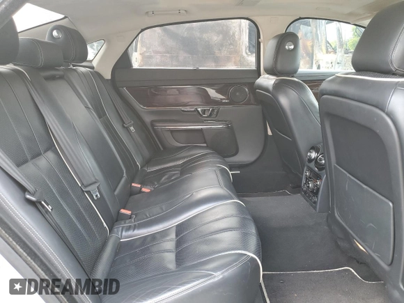 2014 Jaguar XJ Portfolio with VIN SAJWJ2GD2E8V62696, listed as a Copart auction lot 76620494 with 85,487 mi miles and Salvage title. Bid and sale history available at DreamBid. Image 10.