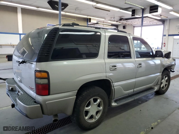 2005 GMC Yukon Denali with VIN 1GKEK63U25J140347, listed as a Copart auction lot 73435764 with 161,028 mi miles and Salvage Title. Bid and sale history available at carsss.com. Image 3.