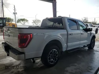 2023 Ford F-150 XL with VIN 1FTEW1CP9PKD19429, listed as a Copart auction lot 58021125 with 13,678 mi miles and Salvage title. Bid and sale history available at DreamBid. Image 3.
