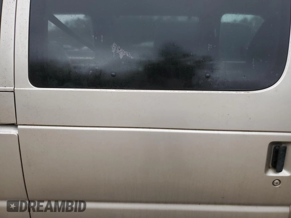 2001 Ford Econoline Passenger XL with VIN 1FBSS31LX1HA23564, listed as a Copart auction lot 77703044 with 276,538 mi miles and Salvage title. Bid and sale history available at DreamBid. Image 11.