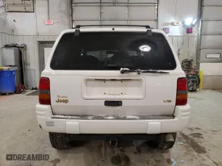 1997 Jeep Grand Cherokee Limited with VIN 1J4GZ78Y5VC747553, listed as a Copart auction lot 49125085 with 0 mi miles and Salvage Title. Bid and sale history available at carsss.com. Image 6.