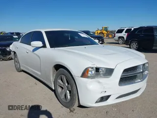 2014 Dodge Charger SXT with VIN 2C3CDXHG2EH104640, listed as a IAAI auction lot 41379760 with 122,664 mi miles. Bid and sale history available at carsss.com. Image 1.