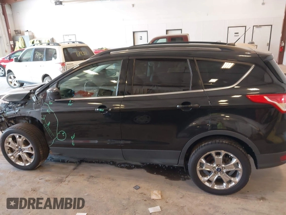 2014 Ford Escape SE with VIN 1FMCU9G95EUA16328, listed as a IAAI auction lot 42464235 with 108,570 mi miles and . Bid and sale history available at DreamBid. Image 14.