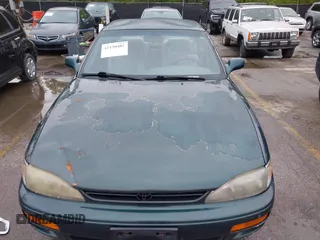 1996 Toyota Camry DX with VIN JT2BG12K5T0346311, listed as a IAAI auction lot 42130482 with 214,872 mi miles. Bid and sale history available at carsss.com. Image 6.