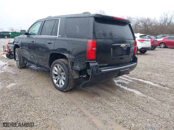 2016 Chevrolet Tahoe LTZ with VIN 1GNSKCKC2GR104305, listed as a IAAI auction lot 41697868 with 124,670 mi miles. Bid and sale history available at carsss.com. Image 3.