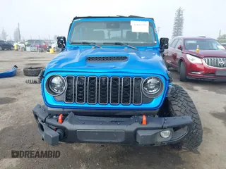 2024 Jeep Gladiator Mojave X z VIN 1C6JJTEG5RL121313, wystawiony jako IAAI lot #41013599 z przebiegiem 2 952 mil mil oraz . Historia ofert i sprzedaży dostępna na DreamBid. Obrazek 13.