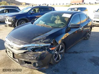 2016 Honda Civic Sedan Touring with VIN 19XFC1F99GE206092, listed as a IAAI auction lot 41031121 with 133,682 mi miles. Bid and sale history available at carsss.com. Image 17.