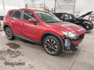 2016 Mazda CX-5 Grand Touring with VIN JM3KE4DY7G0731057, listed as a IAAI auction lot 41118072 with 134,107 mi miles and . Bid and sale history available at carsss.com. Image 1.