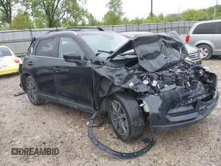 2018 Mazda CX-5 Touring z VIN JM3KFBCM5J0459941, wystawiony jako IAAI lot #42200672 z przebiegiem 129 947 mil mil oraz . Historia ofert i sprzedaży dostępna na DreamBid. Obrazek 1.