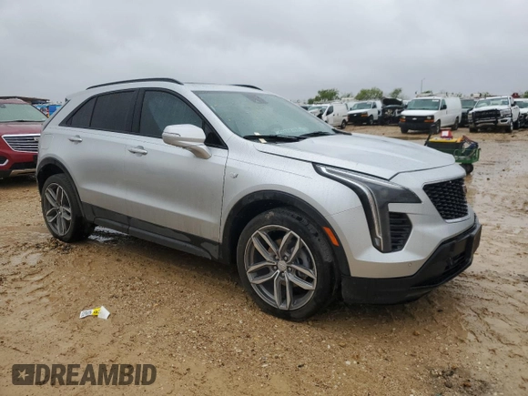 2022 Cadillac XT4 FWD Sport with VIN 1GYFZER47NF111047, listed as a Copart auction lot 50958135 with 14,448 mi miles and Salvage Title. Bid and sale history available at carsss.com. Image 4.