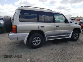 1998 Mitsubishi Montero z VIN JA4MR51RXWJ006418, wystawiony jako Copart lot #54878275 z przebiegiem 225 110 mil mil oraz Szkoda całkowita • Salvage title. Historia ofert i sprzedaży dostępna na DreamBid. Obrazek 3.