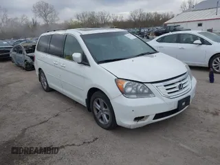 2010 Honda Odyssey Touring with VIN 5FNRL3H99AB005395, listed as a IAAI auction lot 42027445 with 181,559 mi miles. Bid and sale history available at carsss.com. Image 1.