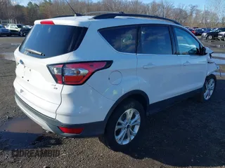 2017 Ford Escape SE with VIN 1FMCU9GD5HUE00425, listed as a IAAI auction lot 41843115 with 64,896 mi miles. Bid and sale history available at carsss.com. Image 4.