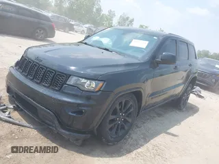 2017 Jeep Grand Cherokee Laredo with VIN 1C4RJFAGXHC818834, listed as a IAAI auction lot 42422744 with 154,287 mi miles and . Bid and sale history available at DreamBid. Image 17.