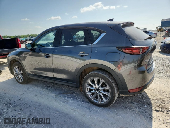 2020 Mazda CX-5 Grand Touring z VIN JM3KFADM2L0803589, wystawiony jako Copart lot #61916825 z przebiegiem 63 663 mil mil oraz Szkoda całkowita • Salvage title. Historia ofert i sprzedaży dostępna na DreamBid. Obrazek 2.