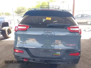 2014 Jeep Cherokee Trailhawk with VIN 1C4PJMBS5EW134900, listed as a IAAI auction lot 41997316 with 96,445 mi miles. Bid and sale history available at carsss.com. Image 16.