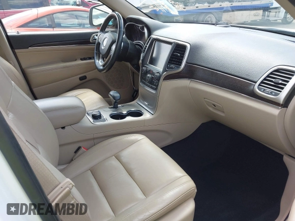 2014 Jeep Grand Cherokee Limited z VIN 1C4RJFBG9EC122590, wystawiony jako IAAI lot #42037881 z przebiegiem 137 270 mil mil oraz . Historia ofert i sprzedaży dostępna na DreamBid. Obrazek 5.