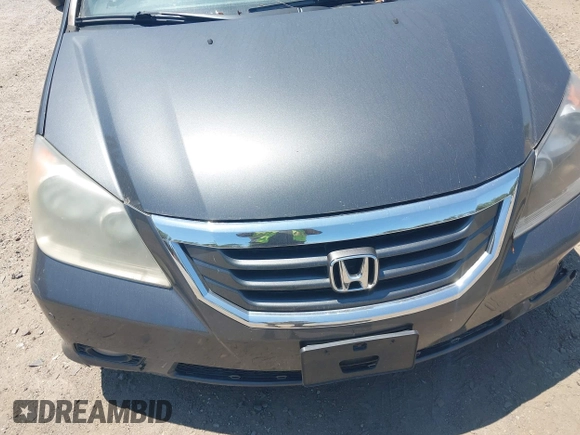 2010 Honda Odyssey Touring z VIN 5FNRL3H90AB085105, wystawiony jako IAAI lot #42142123 z przebiegiem Nie podano mil oraz . Historia ofert i sprzedaży dostępna na DreamBid. Obrazek 10.