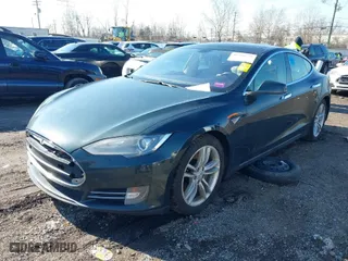 2013 Tesla Model S with VIN 5YJSA1CN7DFP26335, listed as a IAAI auction lot 41529752 with 247,789 mi miles. Bid and sale history available at carsss.com. Image 2.