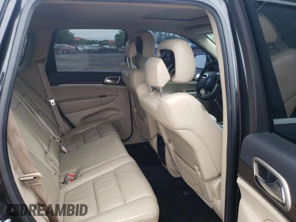 2014 Jeep Grand Cherokee Limited z VIN 1C4RJFBG7EC546642, wystawiony jako Copart lot #61445615 z przebiegiem 128 921 mil mil oraz Szkoda całkowita • Salvage title. Historia ofert i sprzedaży dostępna na DreamBid. Obrazek 10.