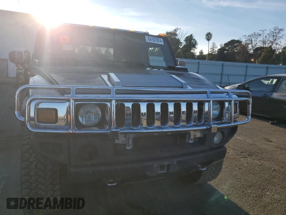 2005 Hummer H2 SUT z VIN 5GRGN22U15H101289, wystawiony jako Copart lot #84107974 z przebiegiem Nie podano mil oraz Szkody całkowita. Historia ofert i sprzedaży dostępna na DreamBid. Obrazek 5.