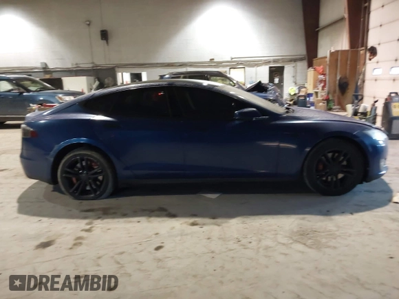 2014 Tesla Model S 60 with VIN 5YJSA1H1XEFP30497, listed as a IAAI auction lot 41294630 with 203,663 mi miles and . Bid and sale history available at DreamBid. Image 13.