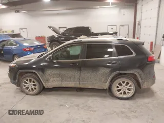 2015 Jeep Cherokee Latitude with VIN 1C4PJLCS8FW689849, listed as a IAAI auction lot 42144161 with 138,740 mi miles and . Bid and sale history available at carsss.com. Image 14.
