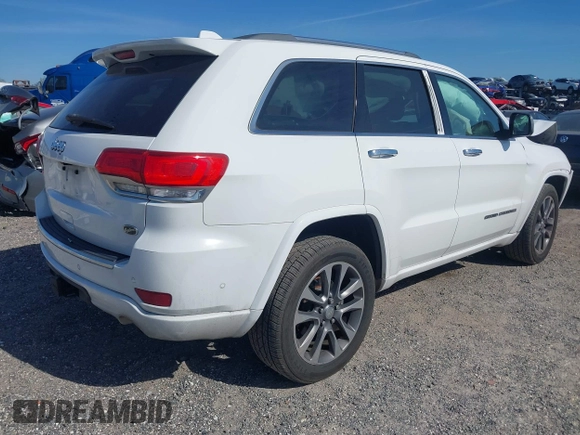 2017 Jeep Grand Cherokee Overland z VIN 1C4RJECG5HC959981, wystawiony jako IAAI lot #41638958 z przebiegiem 102 122 mil mil oraz . Historia ofert i sprzedaży dostępna na DreamBid. Obrazek 4.