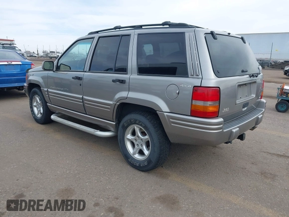 1998 Jeep Grand Cherokee Limited with VIN 1J4GZ88Z6WC307986, listed as a IAAI auction lot 41539972 with 150,652 mi miles. Bid and sale history available at carsss.com. Image 3.