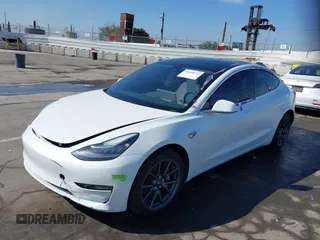 2020 Tesla Model 3 Standard Range Plus with VIN 5YJ3E1EA4LF805205, listed as a IAAI auction lot 41850744 with Not Provided miles. Bid and sale history available at carsss.com. Image 2.