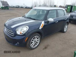 2015 MINI Countryman z VIN WMWZB3C56FWR44706, wystawiony jako IAAI lot #41921628 z przebiegiem 128 530 mil mil oraz . Historia ofert i sprzedaży dostępna na DreamBid. Obrazek 2.