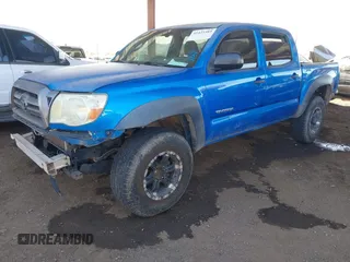 2009 Toyota Tacoma PreRunner with VIN 3TMJU62N69M072481, listed as a IAAI auction lot 41425389 with 212,723 mi miles. Bid and sale history available at carsss.com. Image 2.